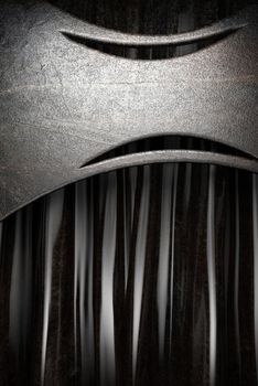 Metal on black silk curtain