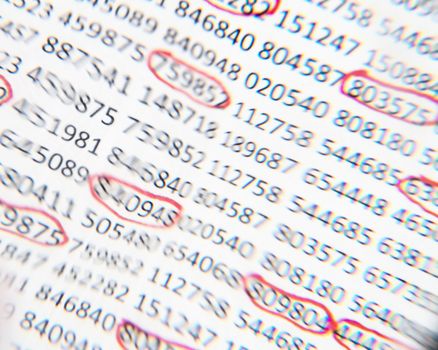 Image of numbers with some circled in red taken through a lens that distorted their image as though the numbers are trying to change.
