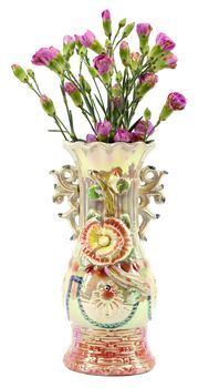 Ornate vase with pink carnations on white background