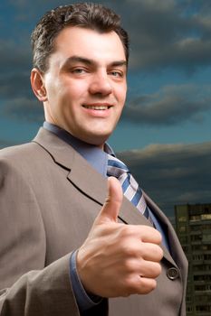 man in a suit against the evening sky