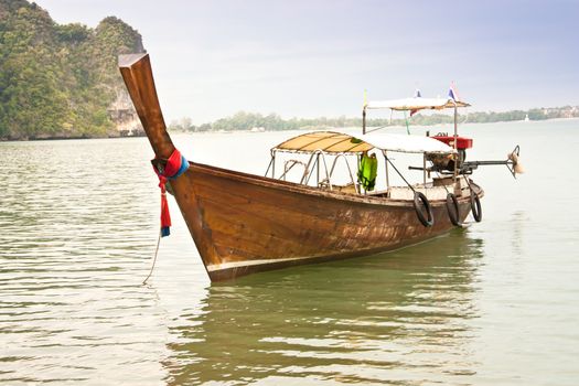 Local fishing boats. Moored in the harbor where the water is not deep.