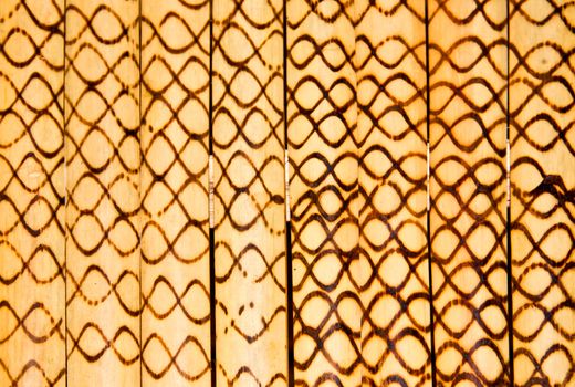Bamboo walls are decorated with motifs.