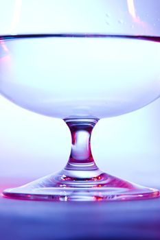 glass for brandy  on blue and red background