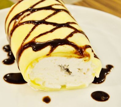 Soft roll cake with chocolate sauce