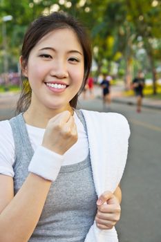 Happy woman showing a fist