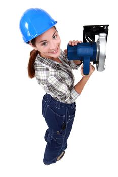 craftswoman holding an electric saw