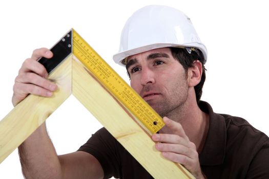 Carpenter making a frame