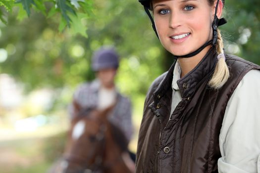 young woman riding a horse