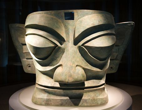 Three Thousand Year Old Large Broze Mask Statue Sanxingdui Three Star Mound Museum Guanghan Chengdu Sichuan China The statues have been carbon dated to the 11th-12th Century BCE.