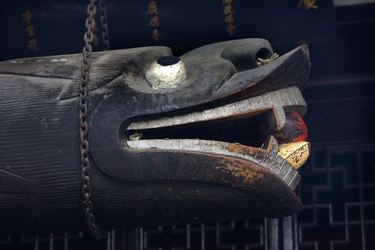 Wooden Dragon Bell Baoguang Si Shining Treasure Buddhist Temple Chengdu Sichuan China Front of Temple