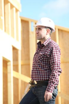 craftsman building a wooden house