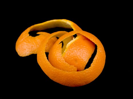 Orange peel on black background