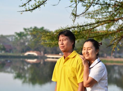 Happy couple at beautiful park outdoor in nature 