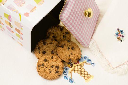 Chocolate cookie jar on the embroidered tablecloth