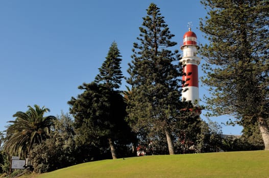 The historical lighthouse in Swakopmund, Namibia. Commissioned in 1903 and originally 11 metres high, the height extended in 1910 to the present height of 111 ft, 34 meters. This lighthouse has a focal plane of 35 m (115 ft) with a 28 m (111 ft) round tower with lantern and double gallery.