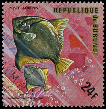 Republic of Burundi, - CIRCA 1975: A stamp printed by Burundi shows the fish Monodactylus argenteus, circa 1975