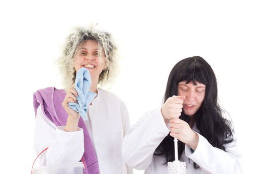 Female cleaners in white work coats