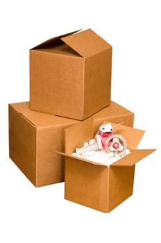 Shipping boxes with packing peanuts and tape dispenser isolated on white background with clipping path.