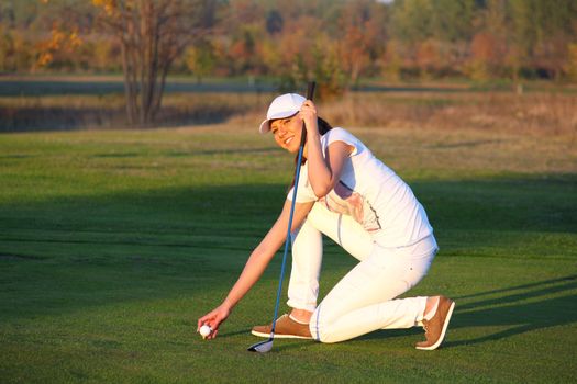 beautiful girl golf player on field