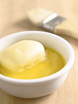 close up of a bowl of melted butter