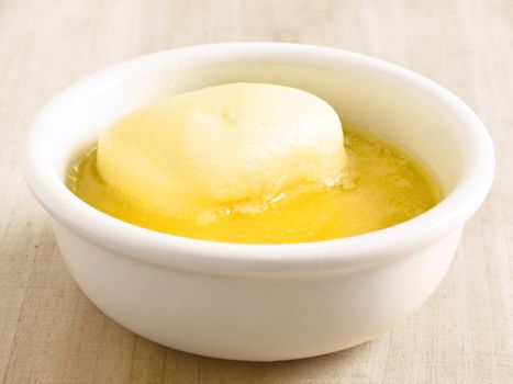 close up of a bowl of melted butter