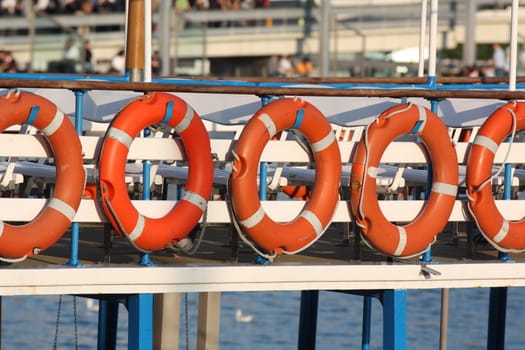 Lifebuoys row on a boat
