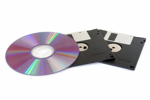CD and floppy disk isolated on white