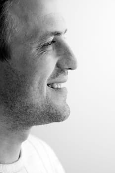 The smiling man half face close up