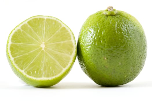 fresh green limes on a white background