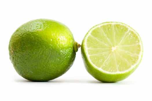 fresh green limes on a white background