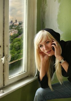 Pretty smiling blonde with the phone