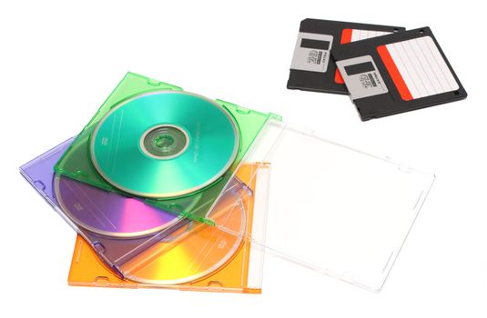 three colored dvd and old floppy discs