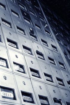 Low angle view of metal mailboxes.