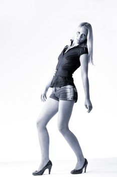 Studio full body portrait of a young blond posing