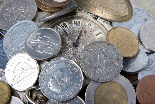 coins and old watch,money of the different countries and timeses