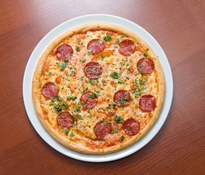 Pizza Pepperoni on plate.Italian kitchen