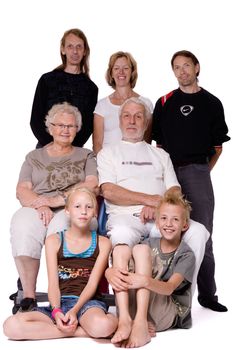 Studio family portrait of a family trying to be serious