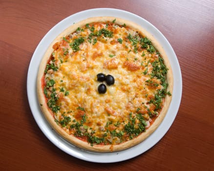 Tasty Italian pizza  on plate.Italian kitchen
