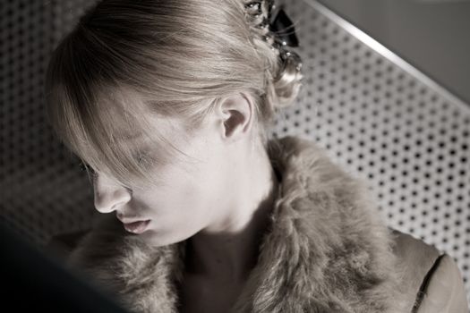 Portrait of a beautiful blond girl looking sad