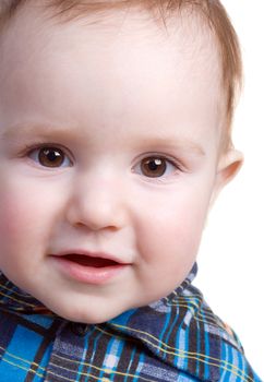 Tot smiles.small boy peers into camera