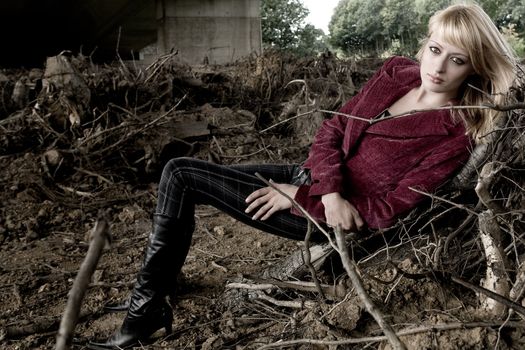 Fashion shoot of woman under a bridge