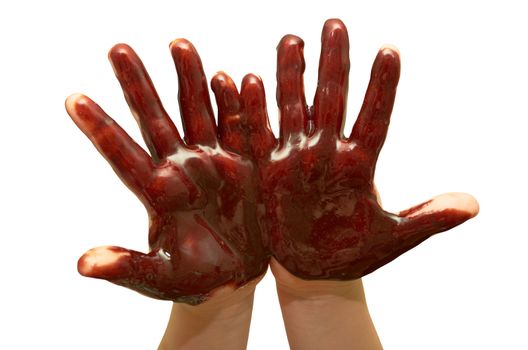 Small children's hands soiled with chocolate glaze