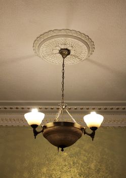 Bronze chandelier (view from below) with moldings