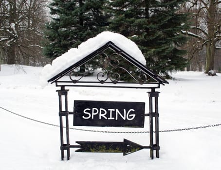 concept steel arrow show spring direction in winter