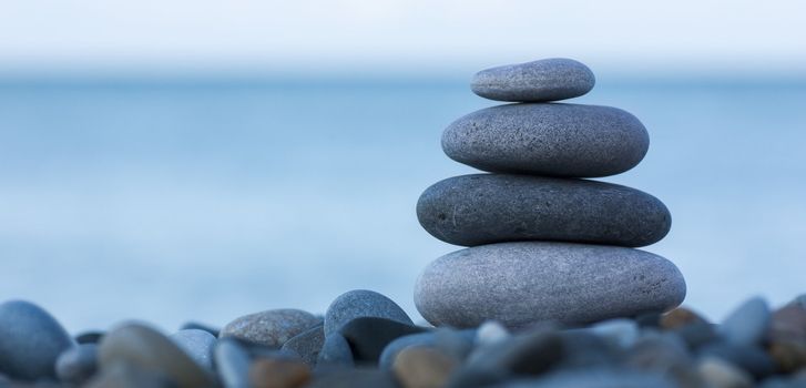 Stack of round smooth stones on a seashore