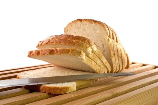 Bread chopping board with knife and slices of white bread