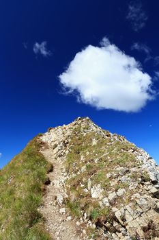 white clouds over mountain summit in Italian Dolomites
