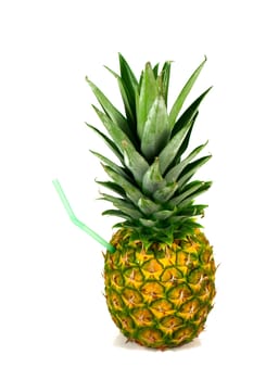 Pineapple with straw to drink the cocktail directly from the pineapple