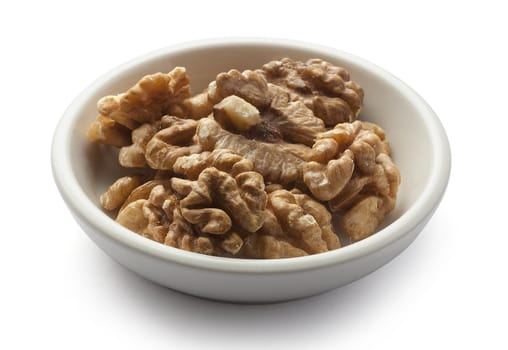 Handful of walnut on the white plate