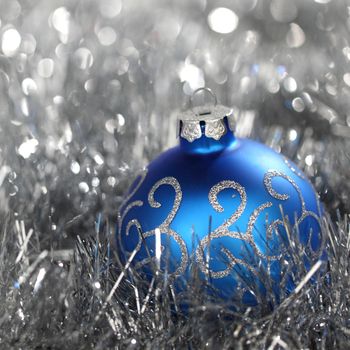 blue christmas ball on silver background